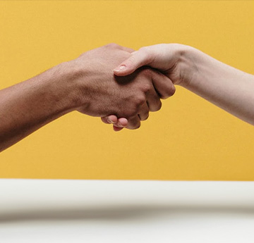a close up picture of a handshake