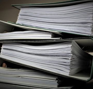 A pile of files full of paper