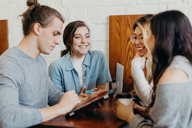 Group of students smiling and chatting