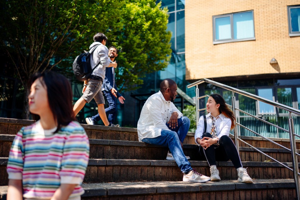 Student chatting outside Digital Technium
