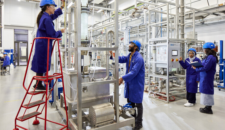 Students working in a lab in uniform