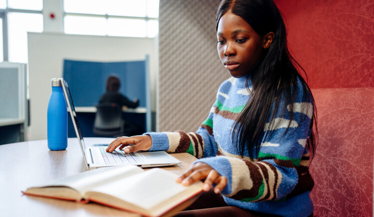 Student on a computer. 