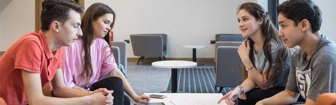 Students working collaboratively around a table